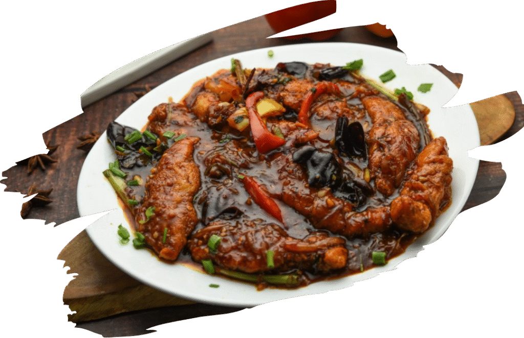 succulent boneless chicken supreme cuts tossed in a fiery and tangy gravy made from garlic, ginger, Kashmiri red chilies, coriander stems, and julienned vegetable