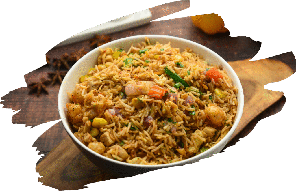 Toasting white rice in oil, then simmering it in a seasoned tomato and broth base. It combines standard pantry staples with vibrant vegetables, egg, chicken, prawn and aromatic Mexican spices